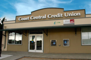 Close up view of credit union building and front doors plus ATM
