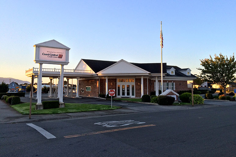 street level view of credit union building and parking lot