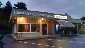 parking lot and credit union building at nightfall