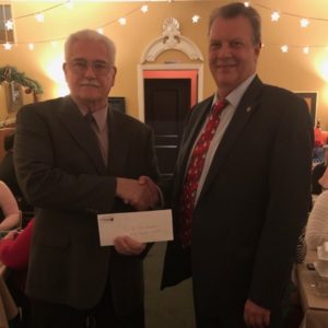 William Tuttle Accepts a check from James Sessa for Butte County Toys for Tots