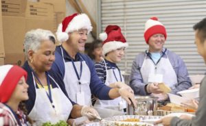 Volunteers serve food at soup kitchen during the winter holidays.